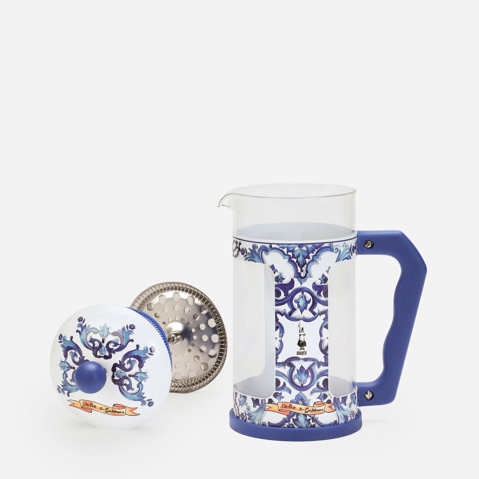 Decorative glass mug with blue and white pattern on a white background